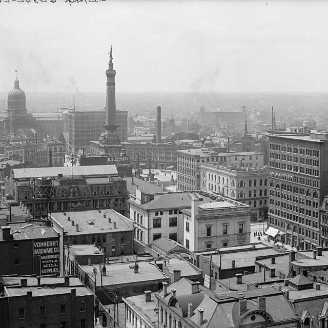 Industrial photograph of late 19th century factory landscape, showcasing urban architecture, relevant for Midjourney prompt engineering.