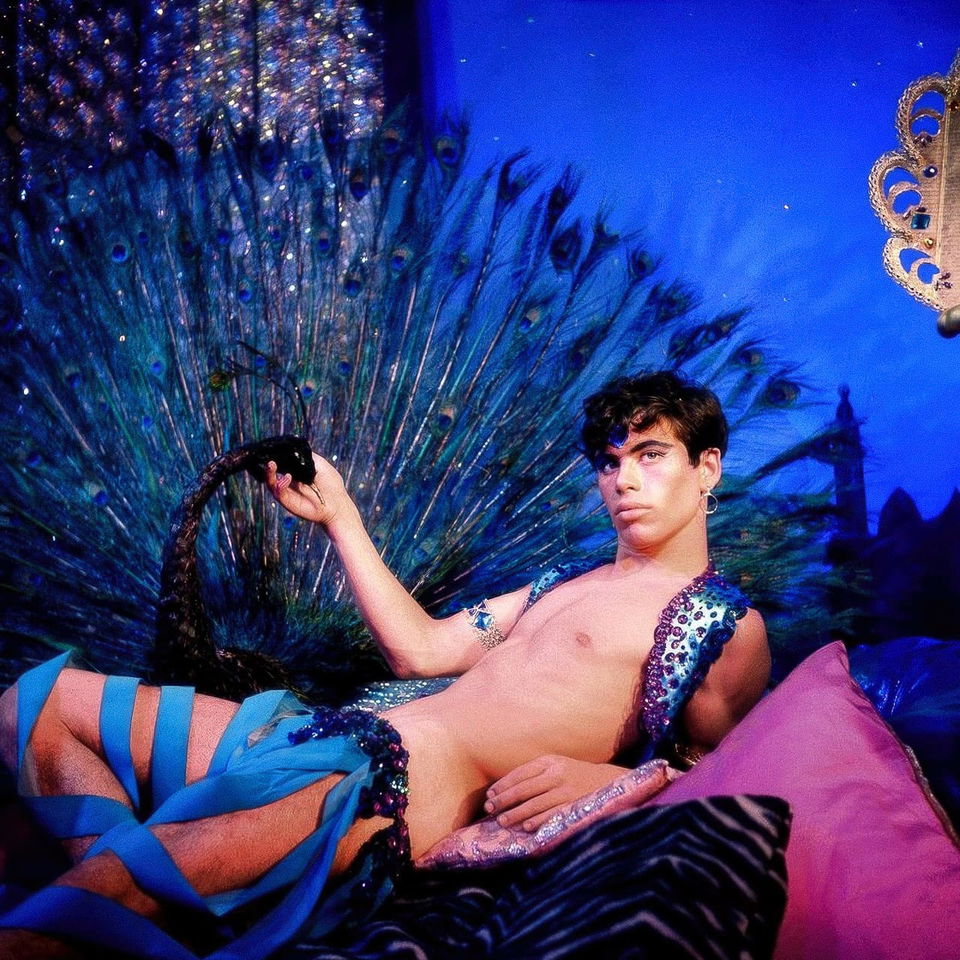Midjourney prompt showcasing surreal aesthetics, vibrant colors, floral themes, inspired by James Bidgood's Harem Boy in front of Peacock, 1960s.