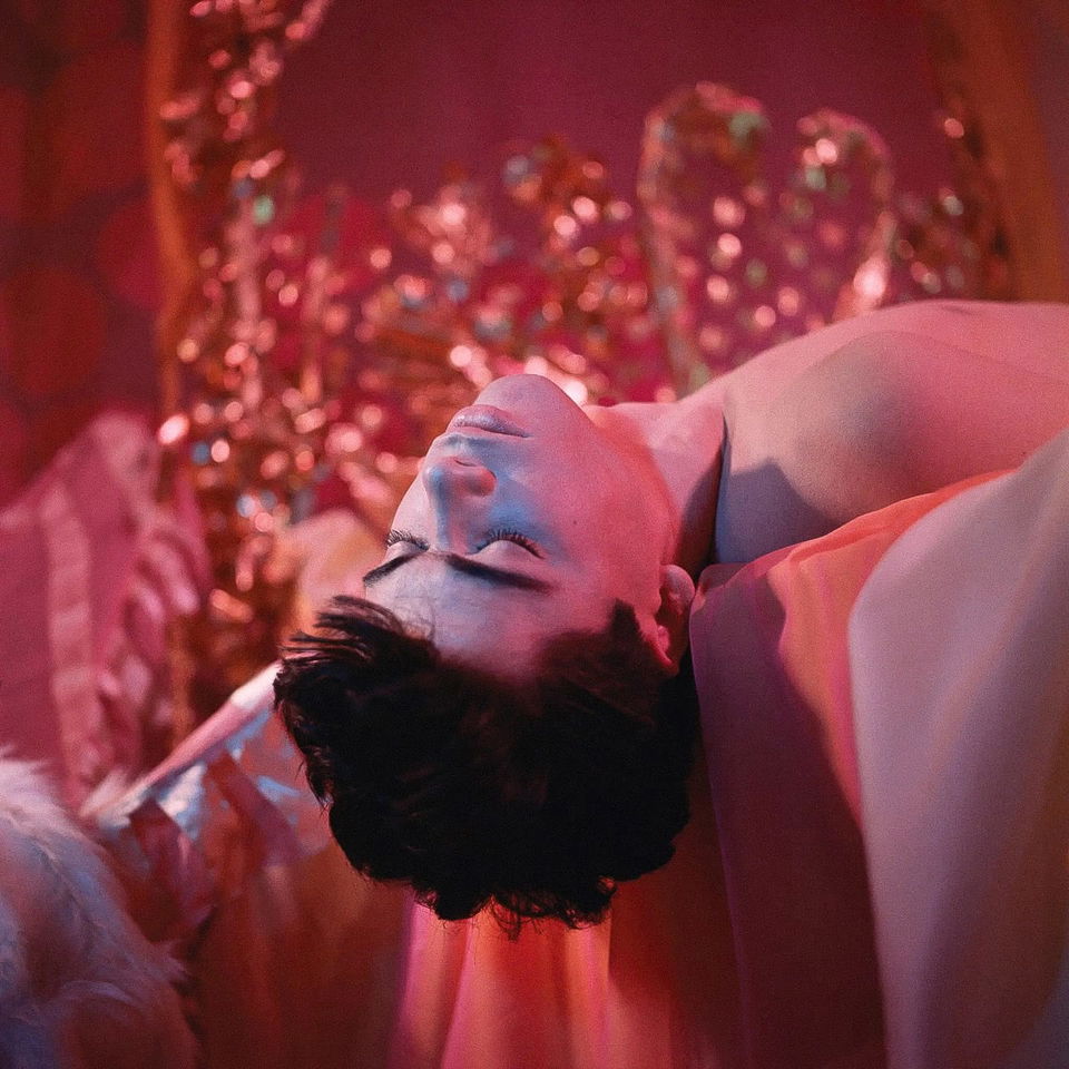 Midjourney prompt showcasing surreal aesthetics, vibrant colors, floral themes, reflecting James Bidgood's style in Hanging Off Bed (Bobby Kendall) image.