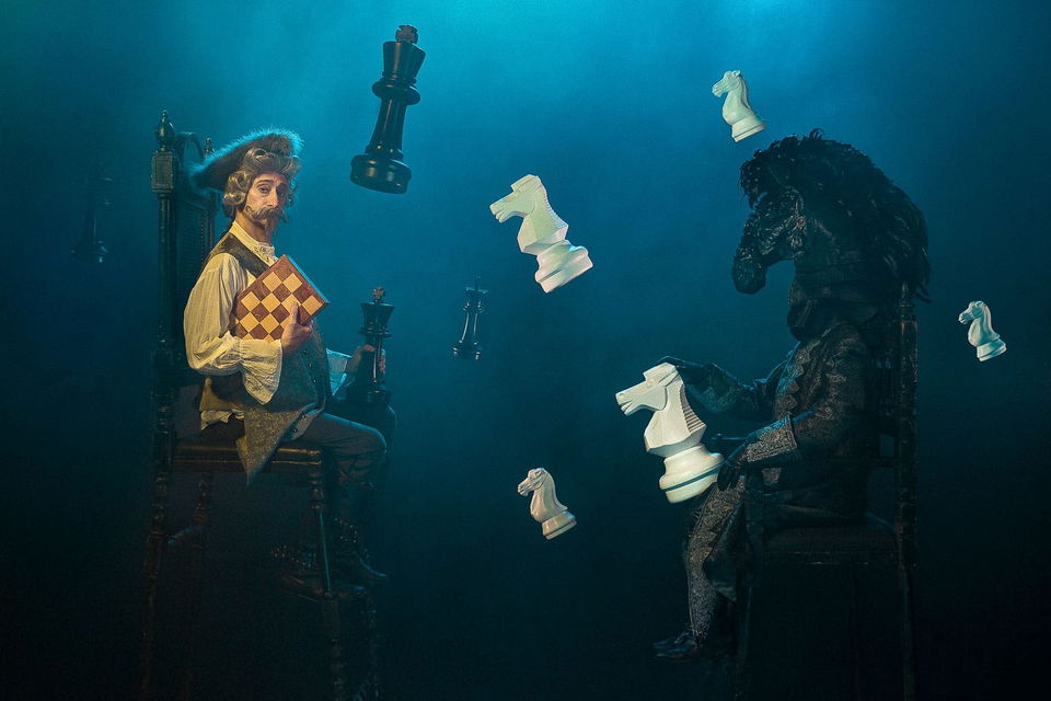 Chess match between a man and a horse-headed figure, theatrical dark fantasy in blue light