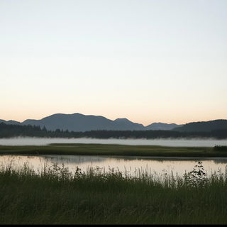 Tenonfire style, Midjourney V6.1: realistic landscape photograph of quiet dawn