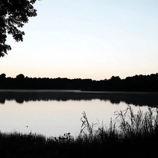 Monolithomontage style, Midjourney V6.1: realistic landscape photograph of quiet dawn