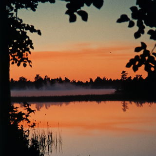 Hatchcoast style, Midjourney V6.1: realistic landscape photograph of quiet dawn