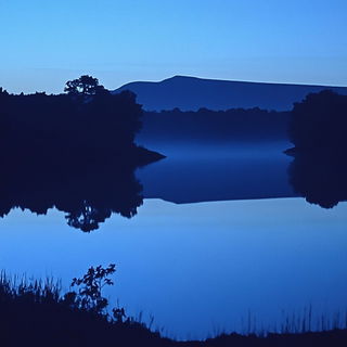 Ocheromontage style, Midjourney V6.1: realistic landscape photograph of quiet dawn