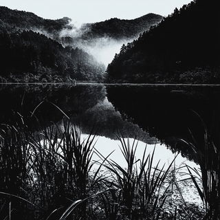 Switchyard Manga Brutalism style, Midjourney V6.1: realistic landscape photograph of quiet dawn