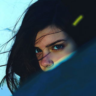 Prismgild style, Midjourney V6.1: photographic portrait of female protagonist
