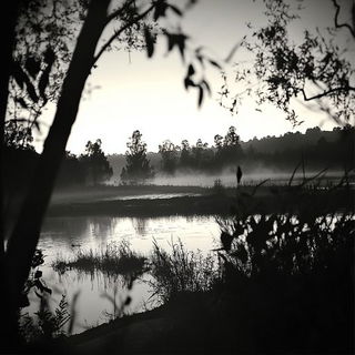 Inkflare Urbanime style, Midjourney V6.1: realistic landscape photograph of quiet dawn