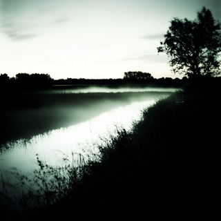 Fableclad style, Midjourney V6.1: realistic landscape photograph of quiet dawn