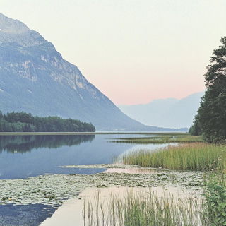 Letterpress Solar Arcade style, Midjourney V6.1: realistic landscape photograph of quiet dawn
