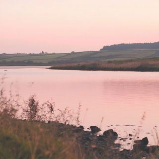 Carminic Cloud Provinces style, Midjourney V6.1: realistic landscape photograph of quiet dawn